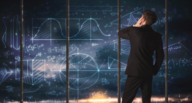 İş adamı iş grafikleri çiziyor