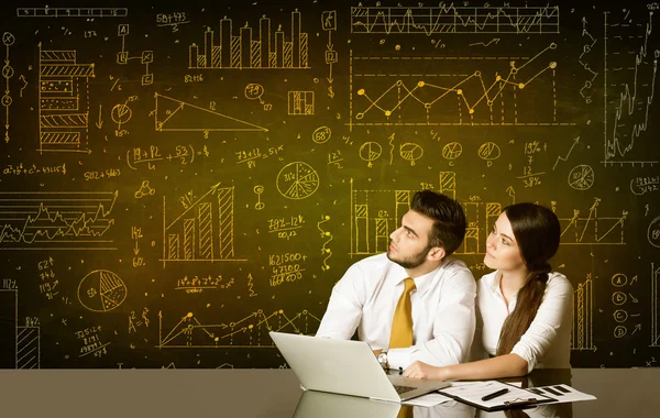 Business couple with diagram background — Stock Photo, Image