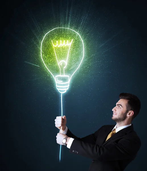 Zakenman met een ideeënlamp — Stockfoto