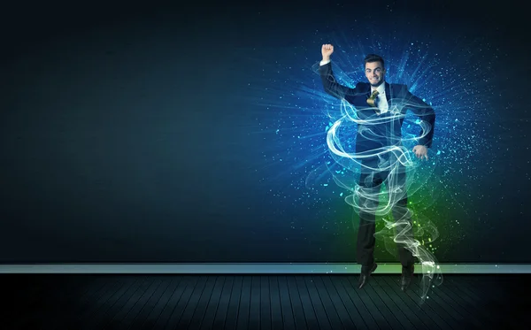 Talented cheerful businessman jumping with glowing energy lines — Stock Photo, Image