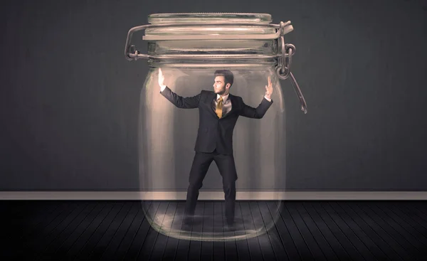 Businessman trapped into a glass jar concept — Stock Photo, Image