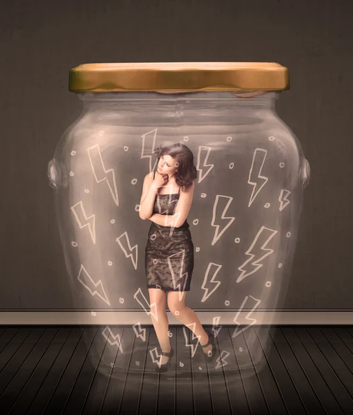 Businesswoman inside a glass jar with lightning drawings concept — Stock Photo, Image