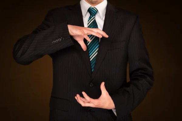 Businessman holding something — Stock Photo, Image