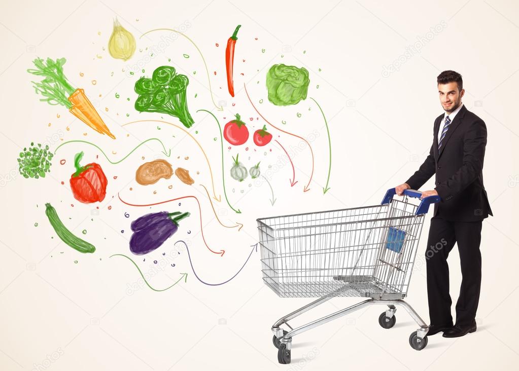 Businessman with shopping cart with vegetables