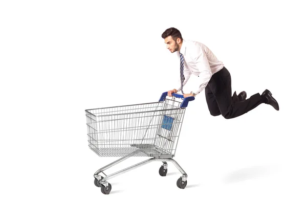 Businessman with shopping cart — Stock Photo, Image