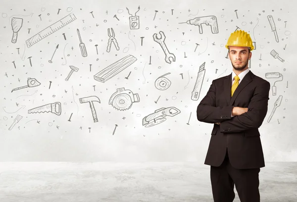 Construction worker planing with hand drawn tool icons — Stock Photo, Image