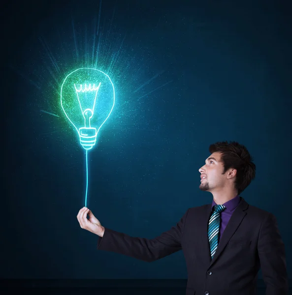 Businessman with an idea bulb — Stock Photo, Image