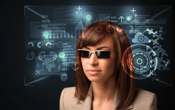 Young woman looking with futuristic smart high tech glasses — Stock Photo, Image