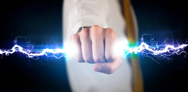 Hombre de negocios sosteniendo luz eléctrica en sus manos — Foto de Stock