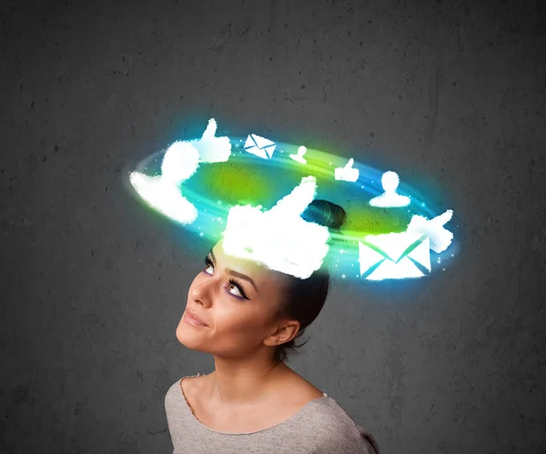 Young teenager with cloud social icons around her head — Stock Photo, Image