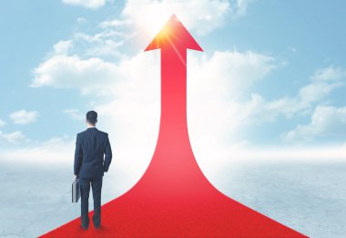 üzerinde kırmızı bir ok ayakta işadamı