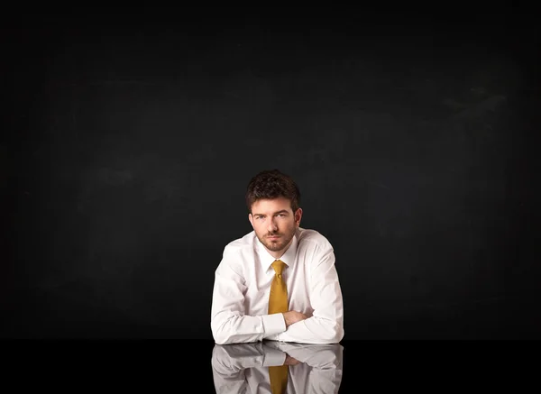 Businessman sitting at a desk — Stock Photo, Image