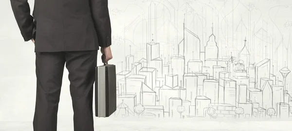 Businessman with drawn city view — Stock Photo, Image