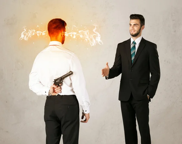 Angry businessman with weapon — Stock Photo, Image