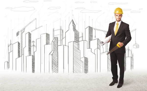 Engineer man with building city drawing in background — Stock Photo, Image