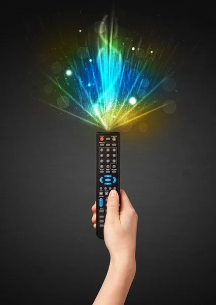 Hand with remote control and explosive signal — Stock Photo, Image