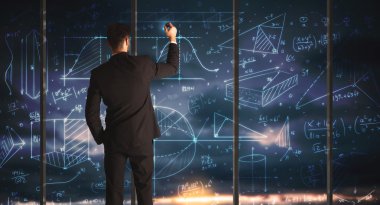 İş adamı iş grafikleri çiziyor