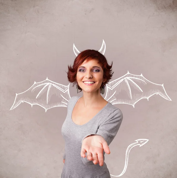 Young girl with devil horns and wings drawing — Stock Photo, Image