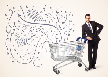 Alışveriş arabalı bir iş adamı.