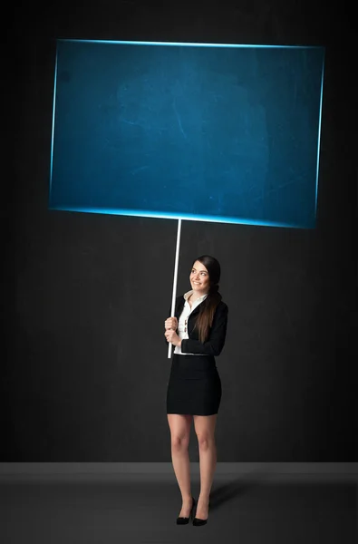 Businesswoman with blue board — Stock Photo, Image