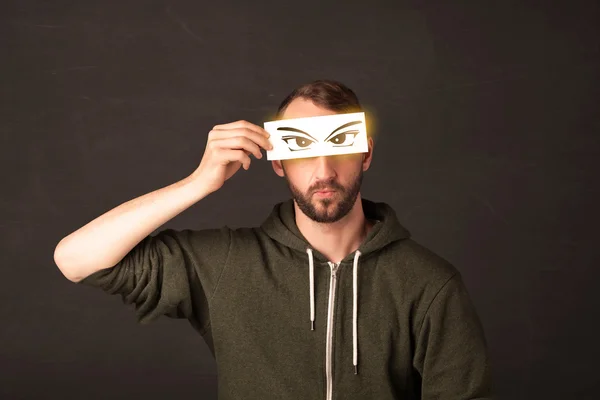 Cool youngster looking with a paper hand drawn eyes — Stock Photo, Image