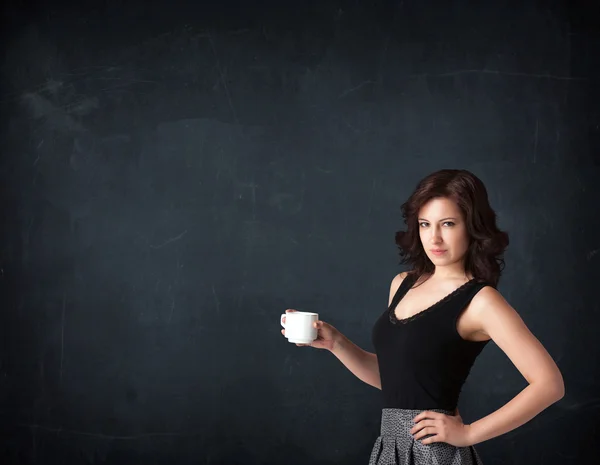 Businesswoman holding a white cup — Stock Photo, Image