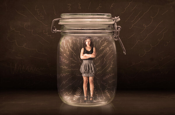 Businesswoman inside a jar with powerful hand drawn lines concep