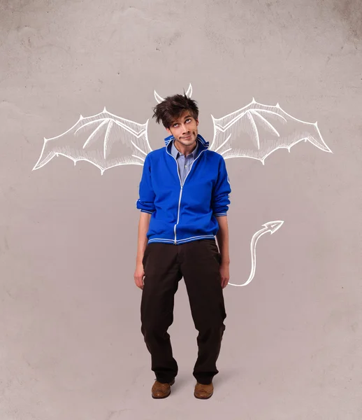 Young man with devil horns and wings drawing — Stock Photo, Image