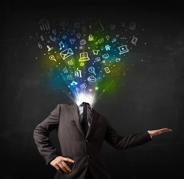 Business man with glowing media icons exploding head — Stock Photo, Image