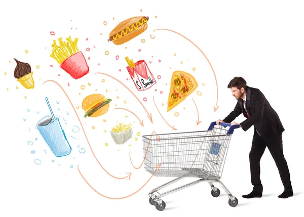 Man with shopping cart with toxic junk food — Stock Photo, Image