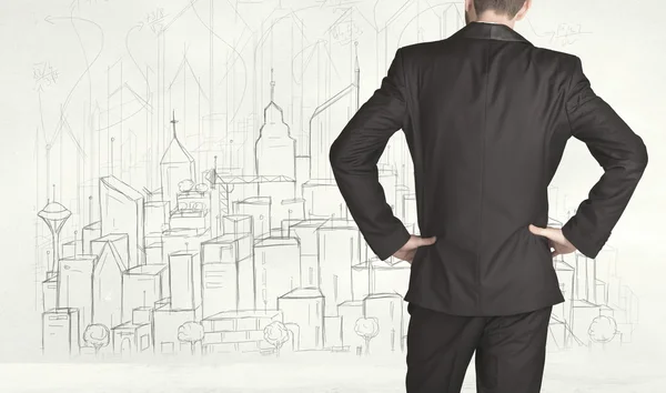 Businessman with drawn city view — Stock Photo, Image