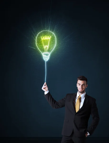 Empresário com uma lâmpada ideia — Fotografia de Stock