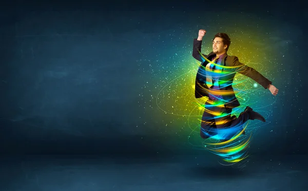 Spännande affärsman hoppar med energi färgglada linjer — Stockfoto