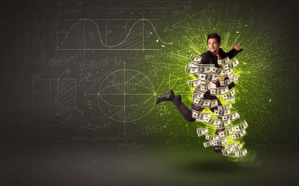 Cheerful businesman jumping with dollar banknotes around him — Stock Photo, Image