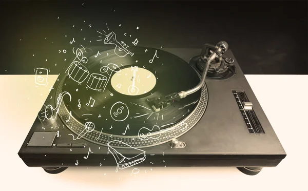 Turntable playing classical music with icon drawn instruments — Stock Photo, Image