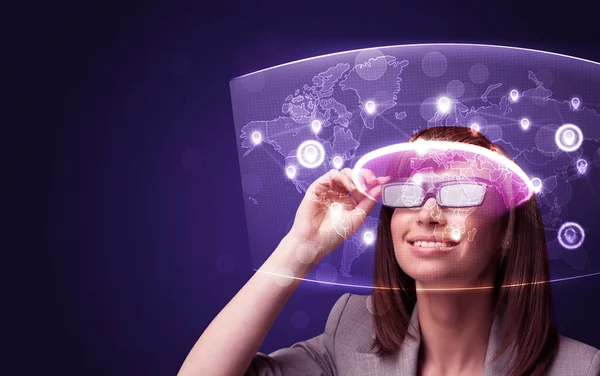 Young woman looking at futuristic social network map — Stock Photo, Image