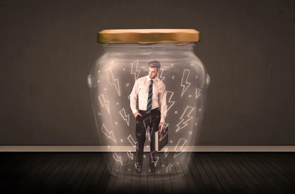 Businessman inside a glass jar with lightning drawings concept — Stock Photo, Image