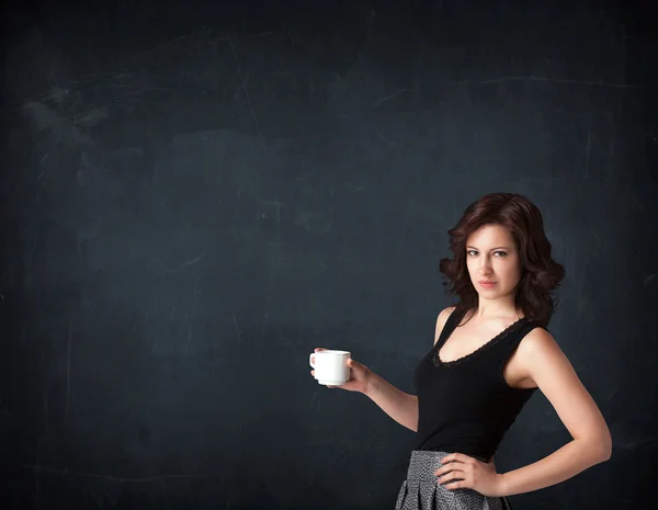 Businesswoman holding a white cup — Stock Photo, Image