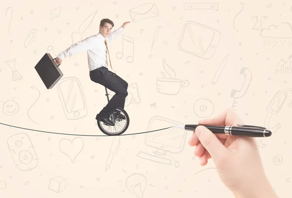 Businessman riding monocycle on a rope drawn by hand — Stock Photo, Image