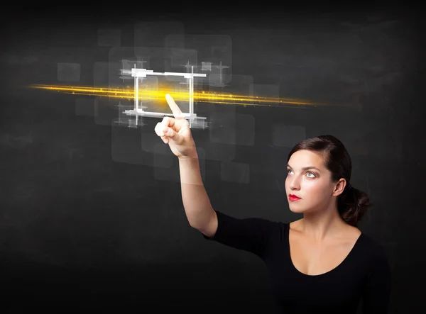 Young tech lady touching button with orange light beams concept — Stock Photo, Image