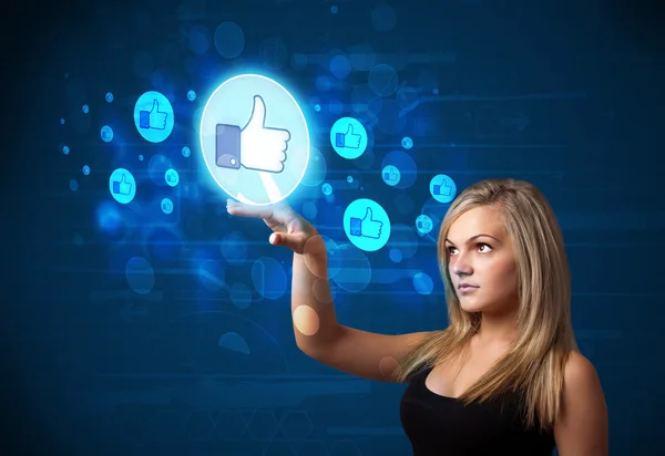 Young businesswoman pressing thumbs up button on modern social n — Stock Photo, Image