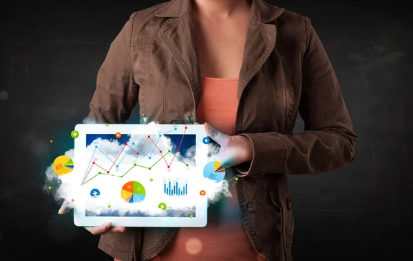 Person holding a touchpad with cloud technology and charts — Stock Photo, Image