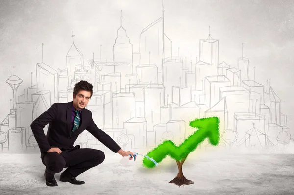 Business man watering green plant arrow — Stock Photo, Image