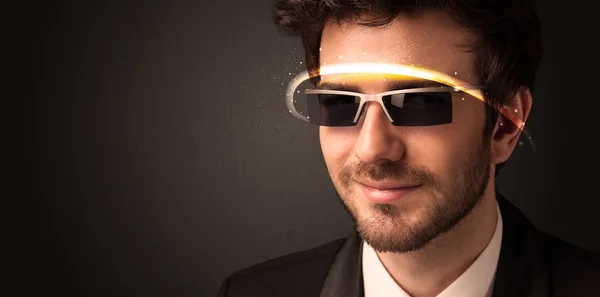 Handsome man looking with futuristic high tech glasses — Stock Photo, Image