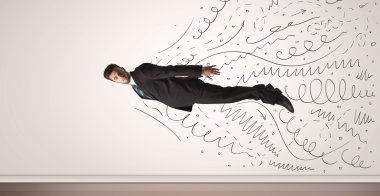 Elle çizilmiş çizgilerle uçan bir iş adamı geliyor. 