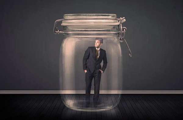 Businessman trapped into a glass jar concept — Stock Photo, Image