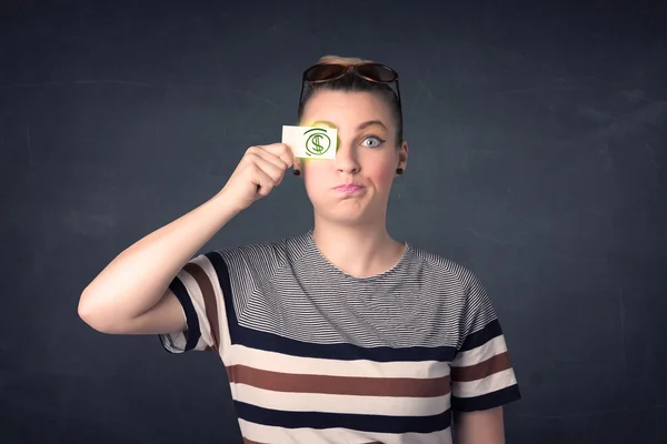 Joven sosteniendo papel con signo de dólar verde — Foto de Stock