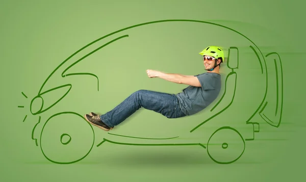 Man drives an eco friendy electric hand drawn car — Stock Photo, Image