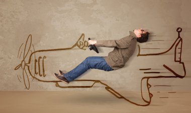 Duvara el çizimi uçak süren komik pilot.