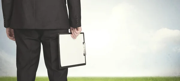 Businessman with meadow — Stock Photo, Image